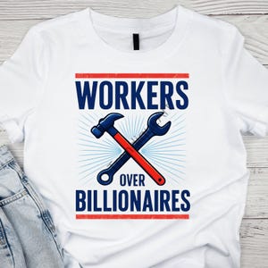 May include: White t-shirt featuring the text "WORKERS OVER BILLIONAIRES" in navy blue. A blue hammer and wrench are crossed, with a red handle on the wrench. The design is set against a light blue burst.