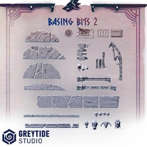 May include: A collection of miniature terrain pieces for tabletop gaming. Includes stone walls, pipes, skulls, and other detailed elements. The text "BASING BITS 2" is displayed at the top. The Greytide Studio logo is at the bottom.