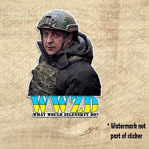 May include: A sticker featuring a cartoon image of a man wearing a military helmet and camouflage clothing. The text "WWZD What Would Zelenskyy Do?" is printed below the image.