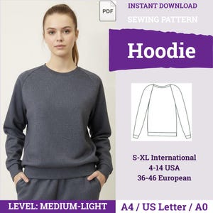Puede incluir: Un patrón de costura digital para una sudadera con capucha, que muestra una sudadera gris oscuro de manga larga con mangas raglán y cuello redondo. El gráfico incluye el texto "INSTANT DOWNLOAD SEWING PATTERN Hoodie", tallas S-XL, 4-14 USA, 36-46 European y A4/US Letter/A0.