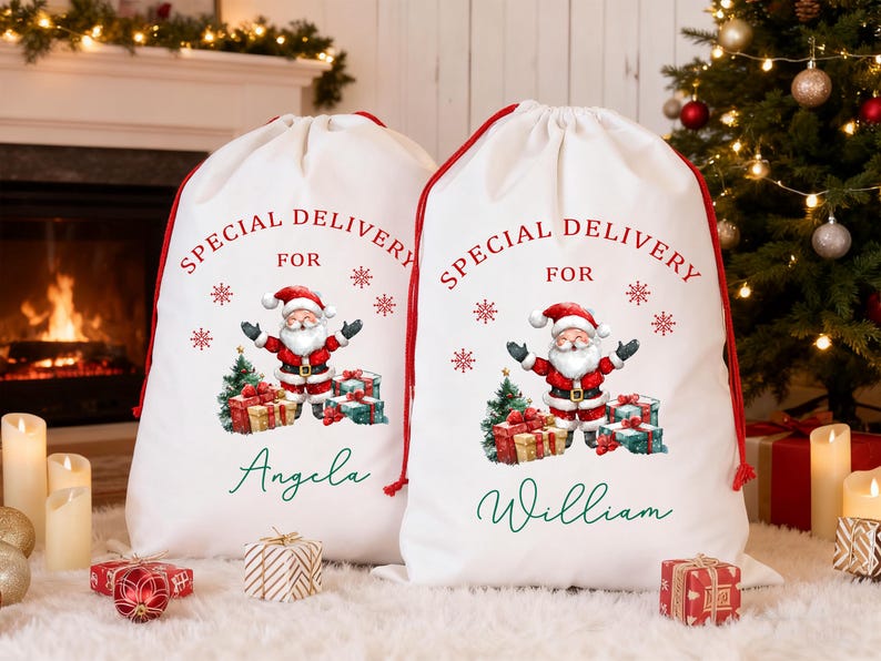 May include: Two white Christmas gift sacks with red drawstrings. Each sack features a Santa Claus graphic, the text "SPECIAL DELIVERY FOR", snowflakes, and a name. A Christmas tree and fireplace are in the background.