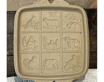 Molde para galletas de mantequilla con forma de animales, estilo vintage de 1990, con forma de bolsa cuadrada de papel marrón.