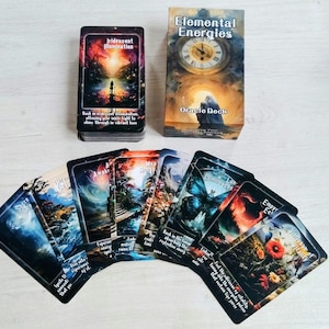 May include: The Elemental Energies oracle deck includes a rectangular box with a clock face illustration, a stack of cards, and several fanned-out cards featuring colourful, surreal artwork, nature scenes, and text captions on each individual card.