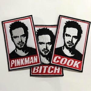 May include: A set of three ceramic mugs with a speckled, matte finish. The mugs are in shades of cream, light gray, and dark gray. Each mug has a simple, minimalist design, perfect for coffee or tea.