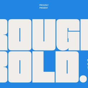 May include: A blue background featuring the words "ROUGH BOLD" in large, white, block letters. The text "NEW BOLD DISPLAY TYPEFACE" is below the main text. Additional text at the top reads "MADE BY TYPORAITH CO", "PROUDLY PRESENT", and "CLEAN MODERN".