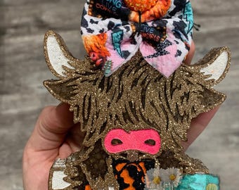 Vaca de las Highlands con calabaza fresca