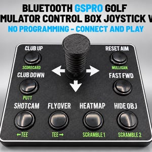 May include: A black Bluetooth GSPRO golf simulator control box joystick V2 with a central joystick and multiple labeled buttons including Club Up, Scorecard, Club Down, Putt, Shotcam, Flyover, Heatmap, Hide Obj, Tee, and Scramble.