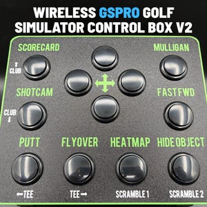 May include: A black wireless GSPRO golf simulator control box V2 with a green border. The device features multiple black circular buttons labeled with functions including Scorecard, Mulligan, Shotcam, Fastfwd, Putt, Flyover, Heatmap, and Hide Object.