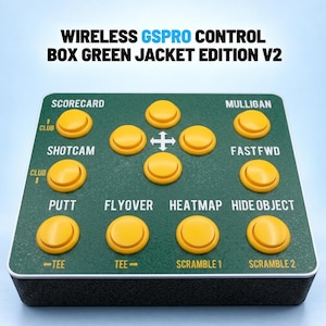May include: A rectangular wireless GSPRO control box Green Jacket Edition V2 with a dark green textured surface and twelve yellow circular buttons. The top panel features white text labels including Scorecard, Mulligan, Shotcam, Fastfwd, Putt, Flyover, Heatmap, Hide Object, Club, Tee, and Scramble.