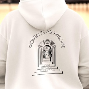 May include: White hoodie with the text "WOMEN IN ARCHITECTURE" and a graphic design on the back. The design features an archway with a checkered pattern and the words "FORM FUNCTION RULE THEM ALL".