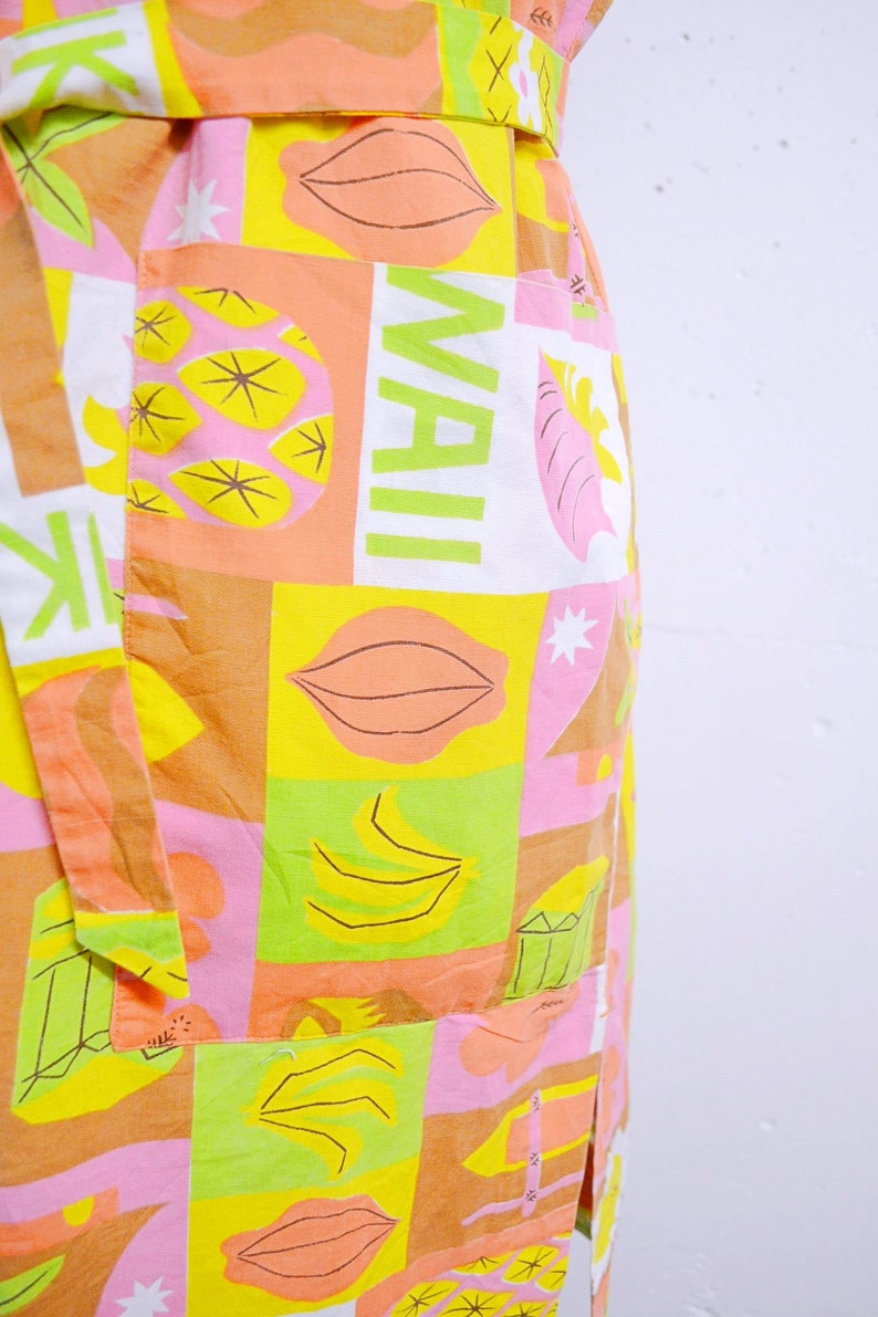 green dress with yellow fish