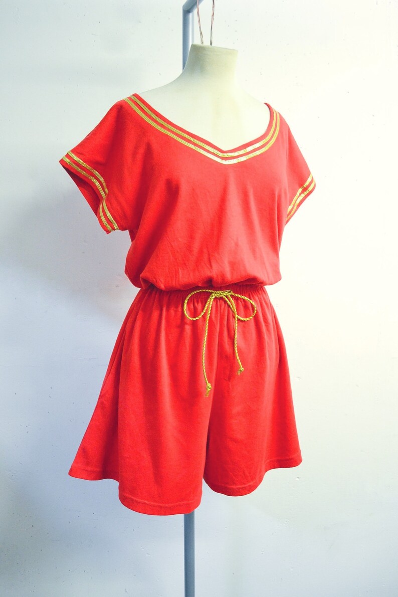 red and gold jumpsuit