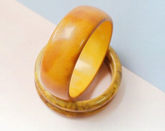 1930s Overdyed bakelite wide bangle, 30s Catalin butterscotch thick bracelet, 40s early plastic jewellery