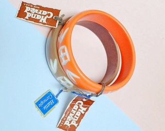1970s Hattie Carnegie hand carved bangles, 70s deadstock resin bracelet pair