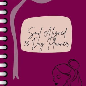 May include: A dark magenta Soul Aligned 30 Day Planner. The planner has a light pink rectangular shape with the title in script. A line drawing of a woman's face is on the bottom right. A light purple ribbon design is at the top.
