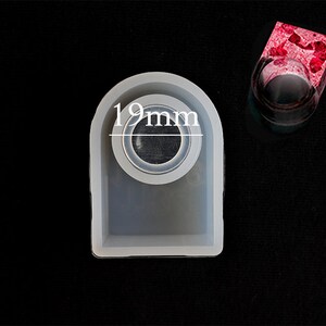 May include: A white silicone mould for making resin rings. The mould has a 19 mm diameter opening for the ring.