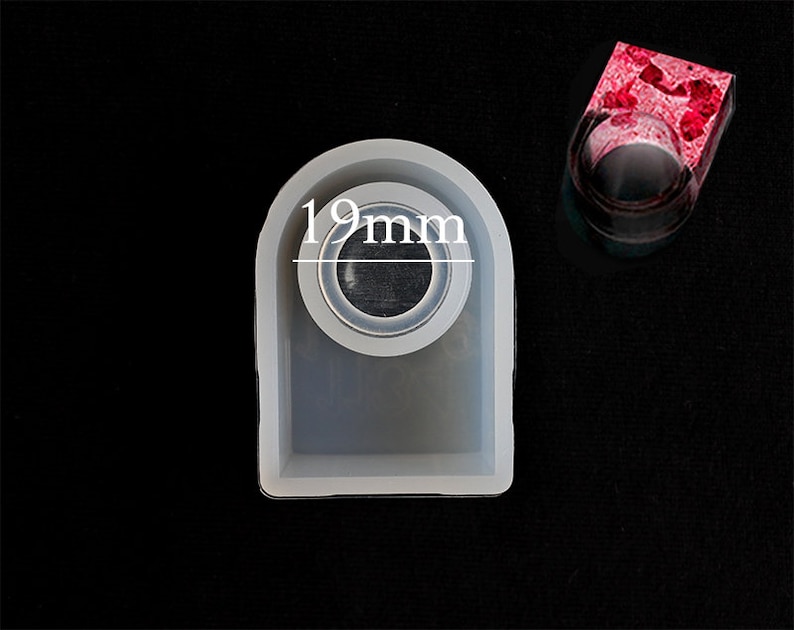 May include: A white silicone mould for making resin rings. The mould has a 19 mm diameter opening for the ring.