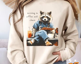 Funny Raccoon Sweatshirt & Hoodie, Coffee and Chaos Shirt, Nurse Raccoon Hoodie, Healthcare Worker Sweatshirt, Nurse Gift, Unisex Pullover