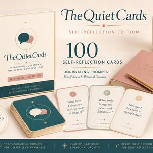 May include: A box set titled The Quiet Cards Self-Reflection Edition containing 100 cards with journaling prompts. The set includes a deck box, three individual cards with questions, a pink notebook, a gold pen, and a candle.