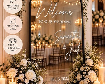 May include: An arched black-framed mirror featuring white vinyl decal text that reads Welcome TO OUR WEDDING Samantha & Jack 09.13.2025. The mirror is surrounded by white floral arrangements and candles, with informational icons and text overlays.