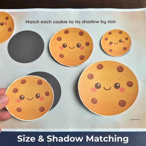 May include: A set of three ceramic mugs with a speckled, matte finish. The mugs are in shades of cream, light gray, and dark gray. Each mug has a simple, minimalist design, perfect for coffee or tea.