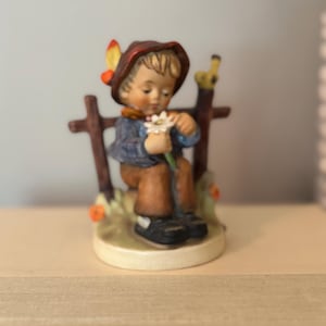 Hummel figurine, &#39;She Loves Me, She Loves Me Not,&#39; model number 174