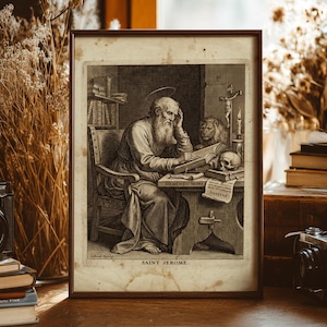 May include: A framed black and white print of Saint Jerome, seated at a desk with a skull, lion, and books. The print includes the text "MEMENTO MORI" and "VANITAS" on the desk. The print is displayed on a wooden surface.