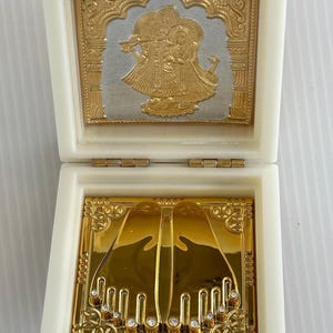 Gold Plated Radha Krishna & Ganesh Charan Paduka in Acrylic Box