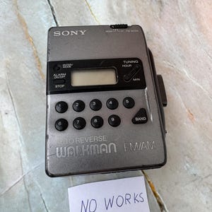 Vintage sony walkman wm-fx30 auto reverse fm/am radio cassette player. For repair or parts. Sold as-is.