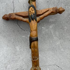 An antique cross with Jesus, hand-carved from wood. Spain, early 20th century. height-12.99 inches
