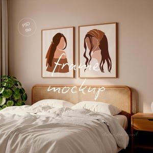 May include: Two framed art prints with abstract female figures in brown and beige tones hang above a bed with a woven headboard. The artwork is displayed in a bedroom setting, with a nightstand and a plant visible.