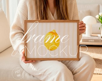 Person Holding Horizontal Frame Mockup, Interior Home Scene, DIN A Wall Art Display (PSD File)