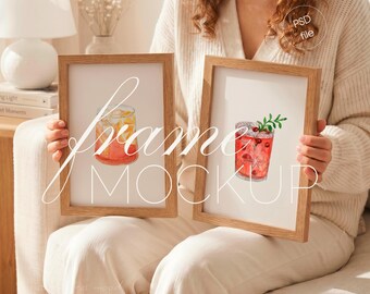 Person Holding Set of 2 DIN A Vertical Wood Frames, Interior Home Mockup (PSD File)