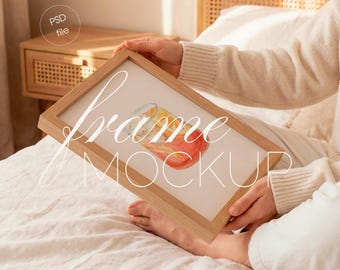 Wood Frame Mockup With Person on Bedroom, DIN A Vertical Wall Art Display (PSD File)