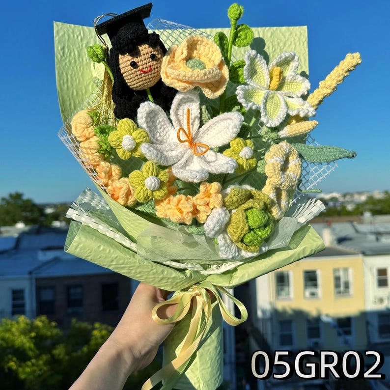 Crochet graduation bouquet in green and white colors with crochet daisies and leaves, cheerful spring style.