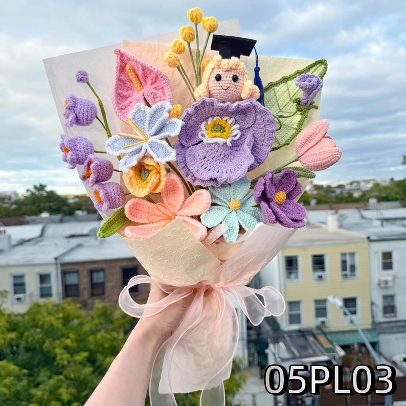 Crochet graduation bouquet in soft pastel tones with lavender and peach flowers, featuring crochet roses and tulip-like blooms.