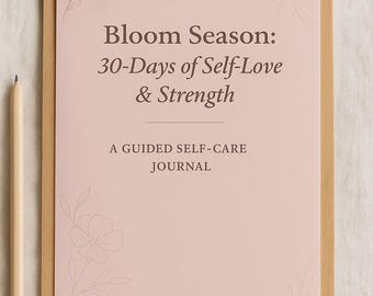 May include: A wooden clipboard holds a pink paper with the text "Bloom Season: 30-Days of Self-Love & Strength" and "A Guided Self-Care Journal." A pencil rests beside it. The clipboard has a silver clip.