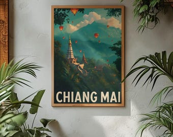Op de afbeelding: Een ingelijste reisposter met een schilderachtig uitzicht op Chiang Mai, Thailand. Het kunstwerk toont een tempelcomplex genesteld in weelderige groene heuvels, met luchtballonnen in de lucht. De poster heeft de woorden "CHIANG MAI" in witte letters.
