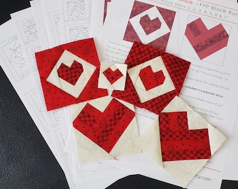 May include: A set of seven red and white heart-shaped quilt blocks, ranging in size from 1 to 7 inches. The blocks are made using foundation paper piecing (FPP) and are designed for quilting projects.
