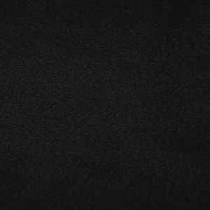 May include: A close-up shot of a black, textured fabric. The fabric has a slightly rough, matte appearance, with subtle variations in tone and texture across its surface. The overall impression is one of depth and richness.
