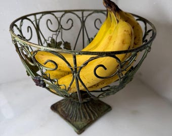 Vintage rustic green metal wire pedestal fruit basket with grape and leaf decorations Tuscan style scrolling design table centerpiece gift