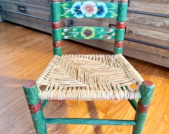 Vintage Mexican folk art miniature child's chair charming rustic green hand-painted wooden frame floral motif woven rush seat toddler chair