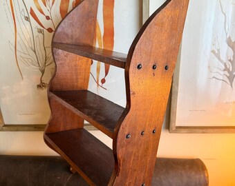 19th-century New England hanging whale tail shelf collectible antique handmade solid maple to display small collectibles, art, or books