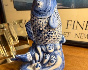 Vintage ceramic koi fish vase pitcher in blue and white Chinoiserie style jumping koi fish posed vertically on waves and rocks China