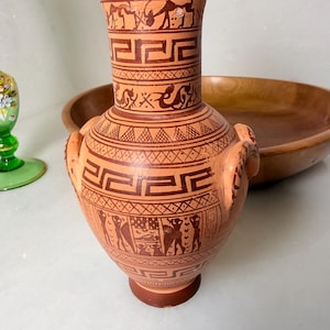 May include: A set of three ceramic nesting bowls in shades of blue, green, and white. The bowls feature a speckled glaze and a simple, modern design. The largest bowl is approximately 6 inches in diameter.