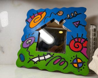 Postmodern pop art hand-painted mirror mid 1990s signed M. Paige titled "What will the neighbors think?" 90s Whimsical/ Memphis Milano style