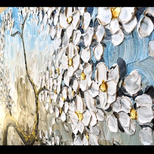 May include: A textured oil painting of a white blossom tree with gold accents on a blue background.