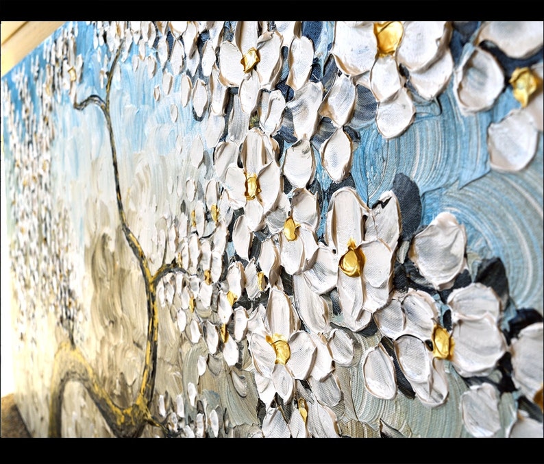 May include: A textured oil painting of a white blossom tree with gold accents on a blue background.