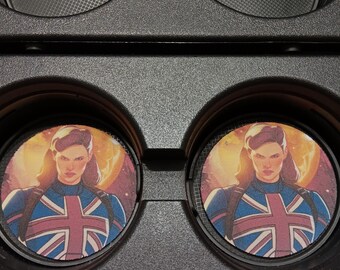 May include: Two car coasters featuring a woman in a blue uniform with a Union Jack design. The coasters are round and fit into a car's cup holders. The background is a warm, golden color.