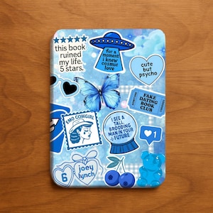 May include: A blue and white decorative phone case featuring various stickers. Stickers include a butterfly, a UFO, a fortune-telling ball, and text that reads "this book ruined my life. 5 stars."